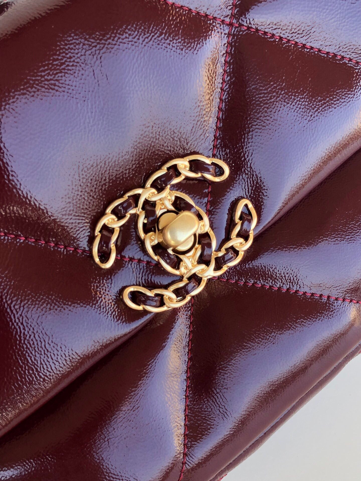 Ch*el 19 handbag shiny leather, gold-tone, silver-tone & ruthenium-finish metal dark red 6.2 × 10.1 × 3.5 in